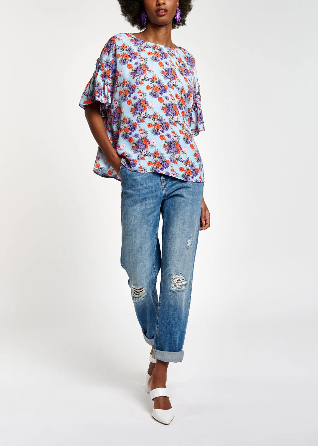 Light blue floral ruffle-sleeved top
