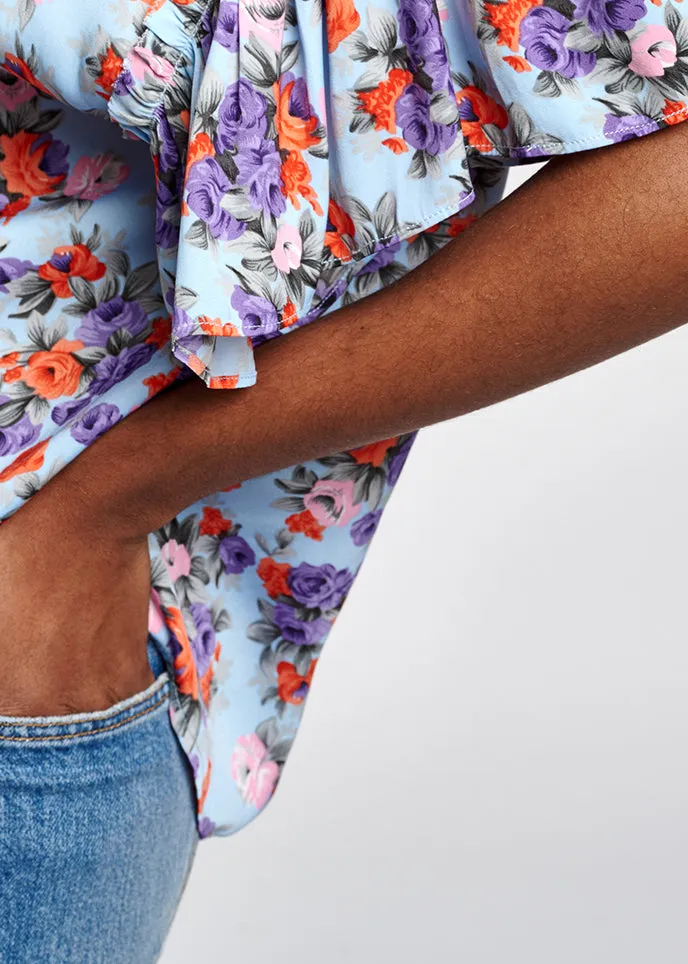 Light blue floral ruffle-sleeved top