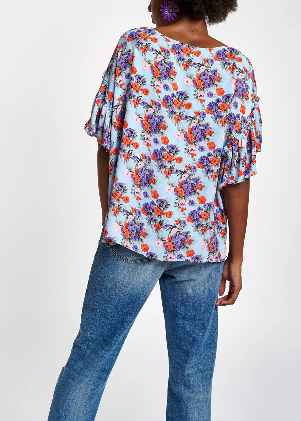 Light blue floral ruffle-sleeved top