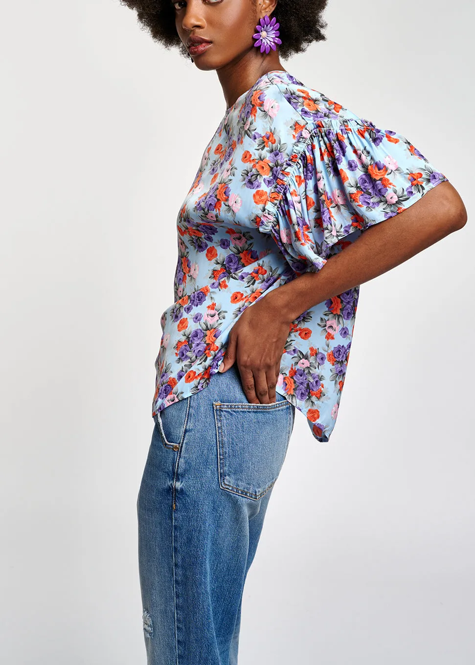 Light blue floral ruffle-sleeved top