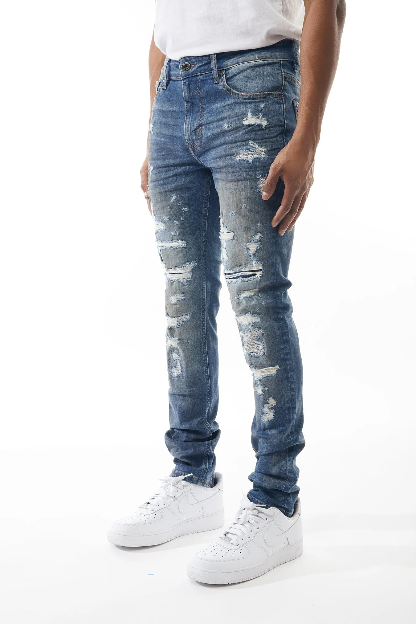 Ripped and Repaired Denim Jeans in Blizzard