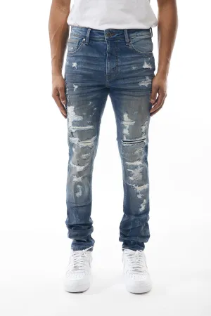 Ripped and Repaired Denim Jeans in Blizzard